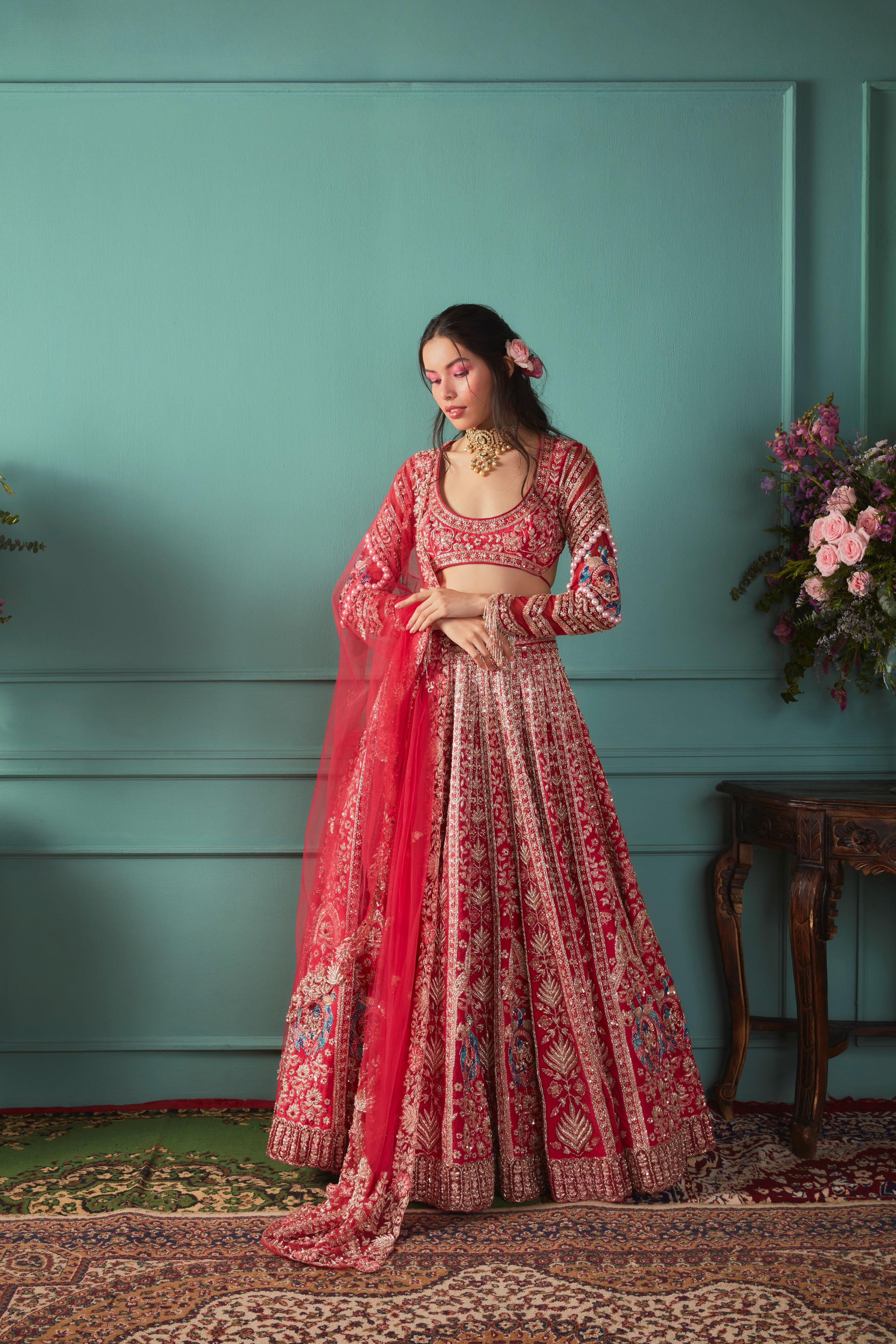 RED LEHENGA WITH PEACOCK ELEMENTS