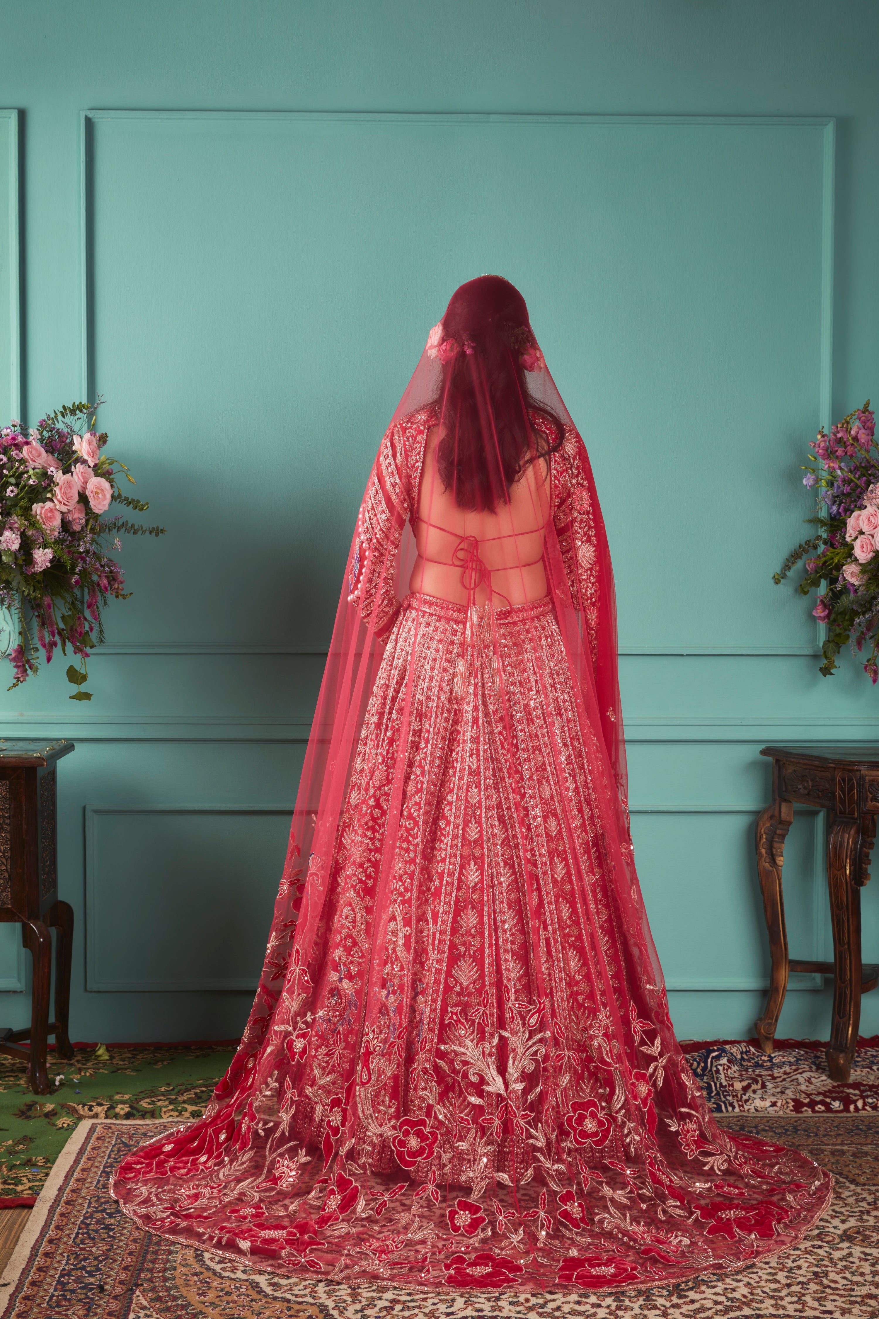 RED LEHENGA WITH PEACOCK ELEMENTS