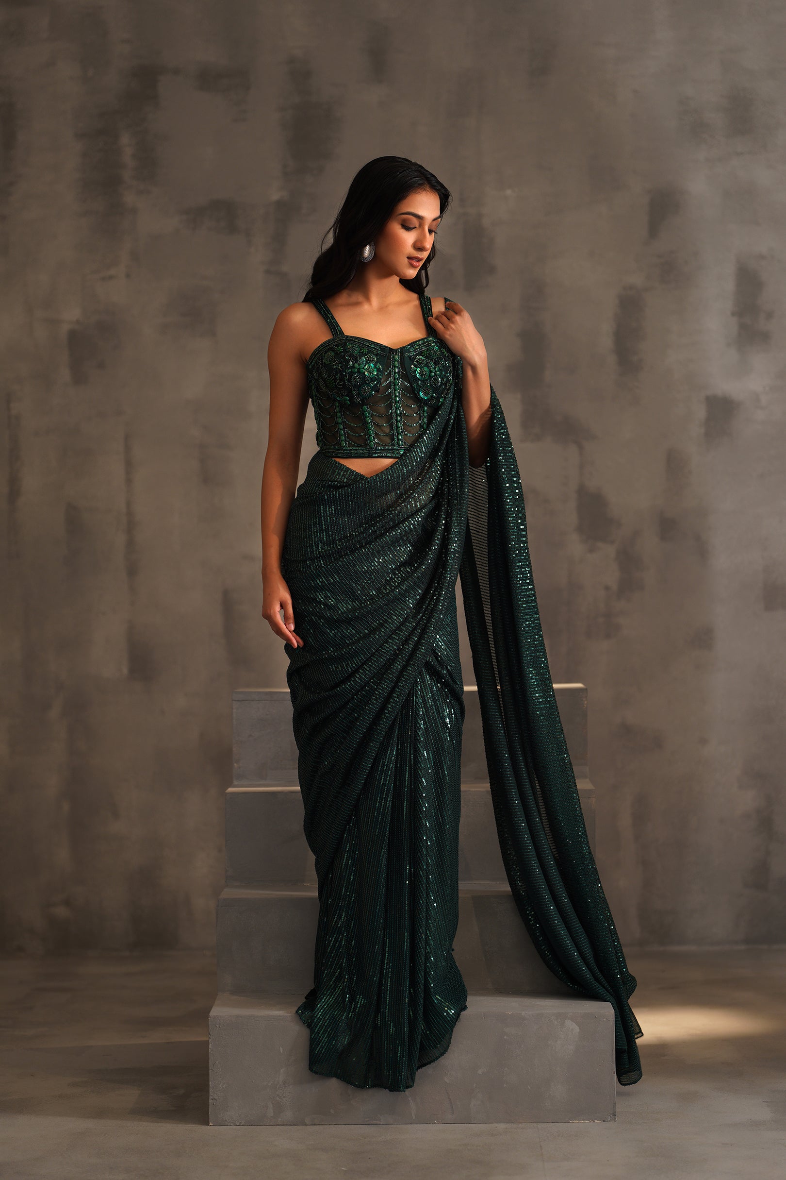 BOTTLE GREEN EMBROIDERED CORSET AND DRAPE SAREE