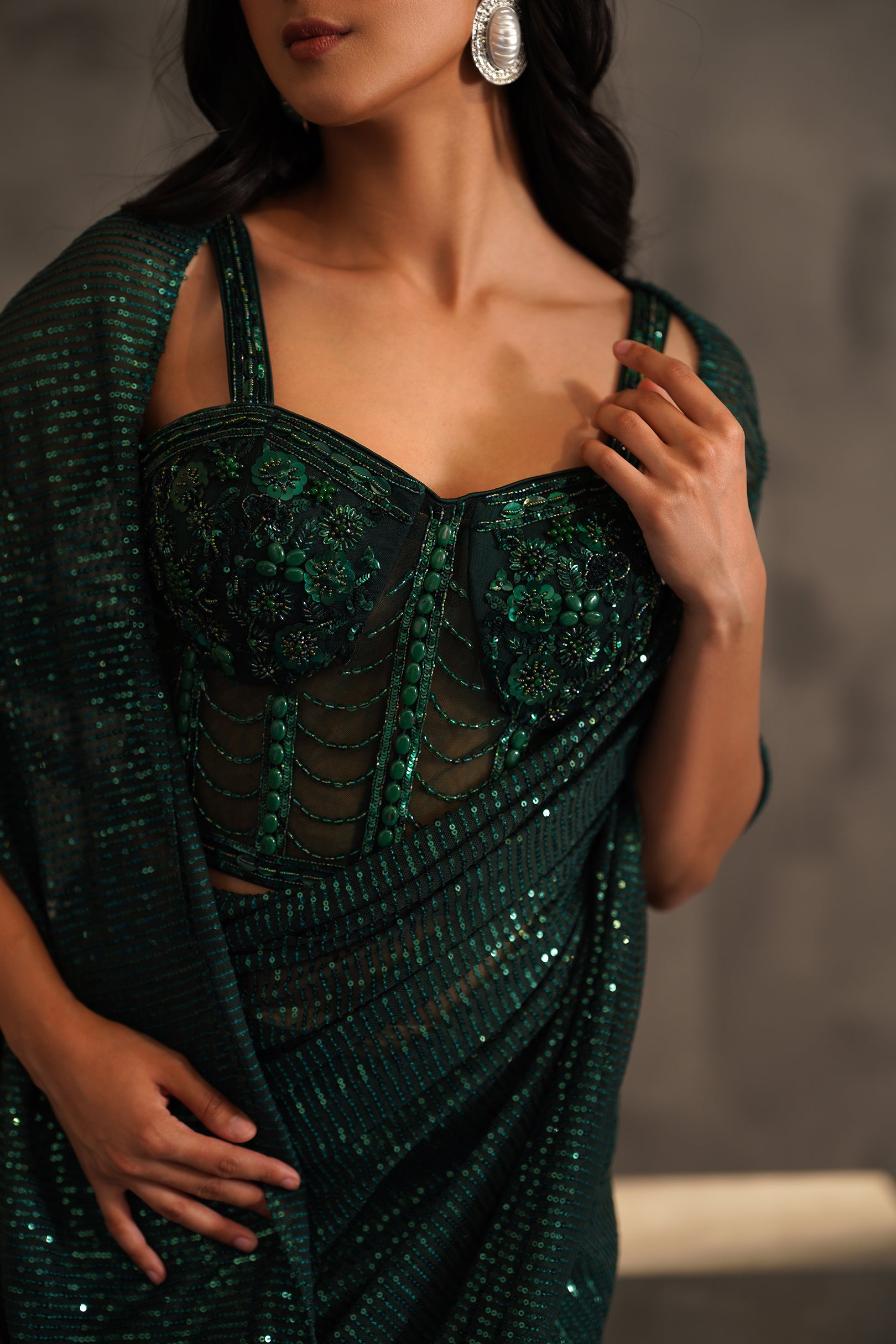 BOTTLE GREEN EMBROIDERED CORSET AND DRAPE SAREE