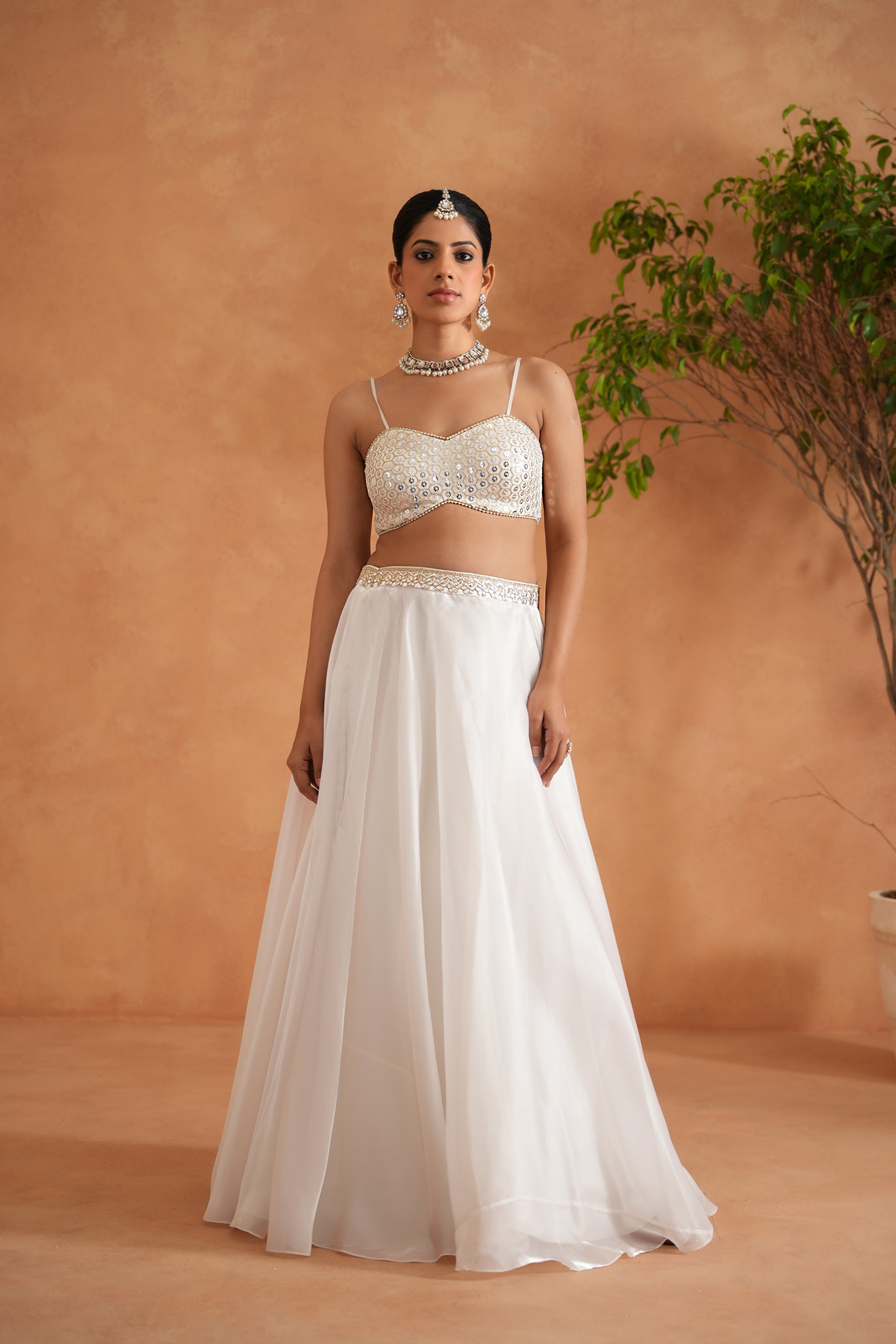 IVORY EMBROIDERED BUSTIER, LEHENGA AND SHORT JACKET