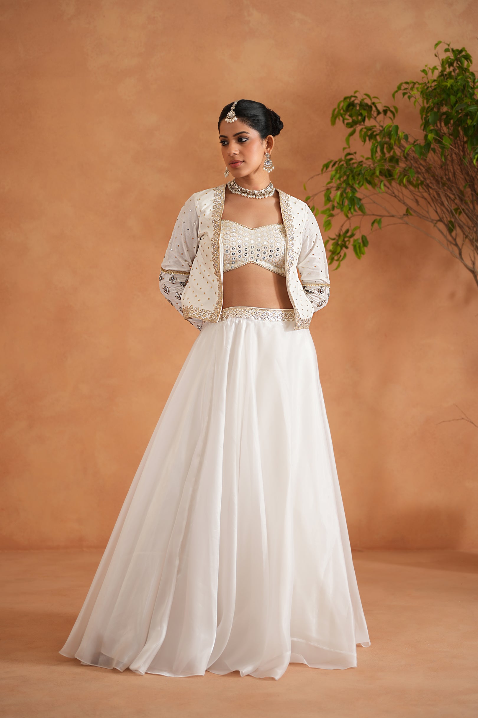 IVORY EMBROIDERED BUSTIER, LEHENGA AND SHORT JACKET