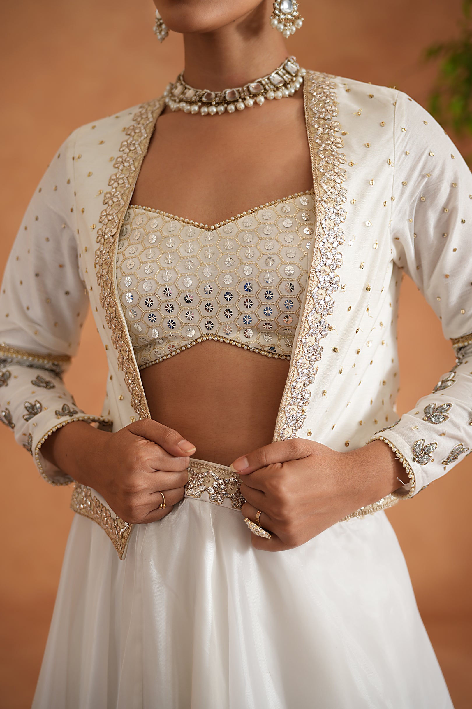 IVORY EMBROIDERED BUSTIER, LEHENGA AND SHORT JACKET