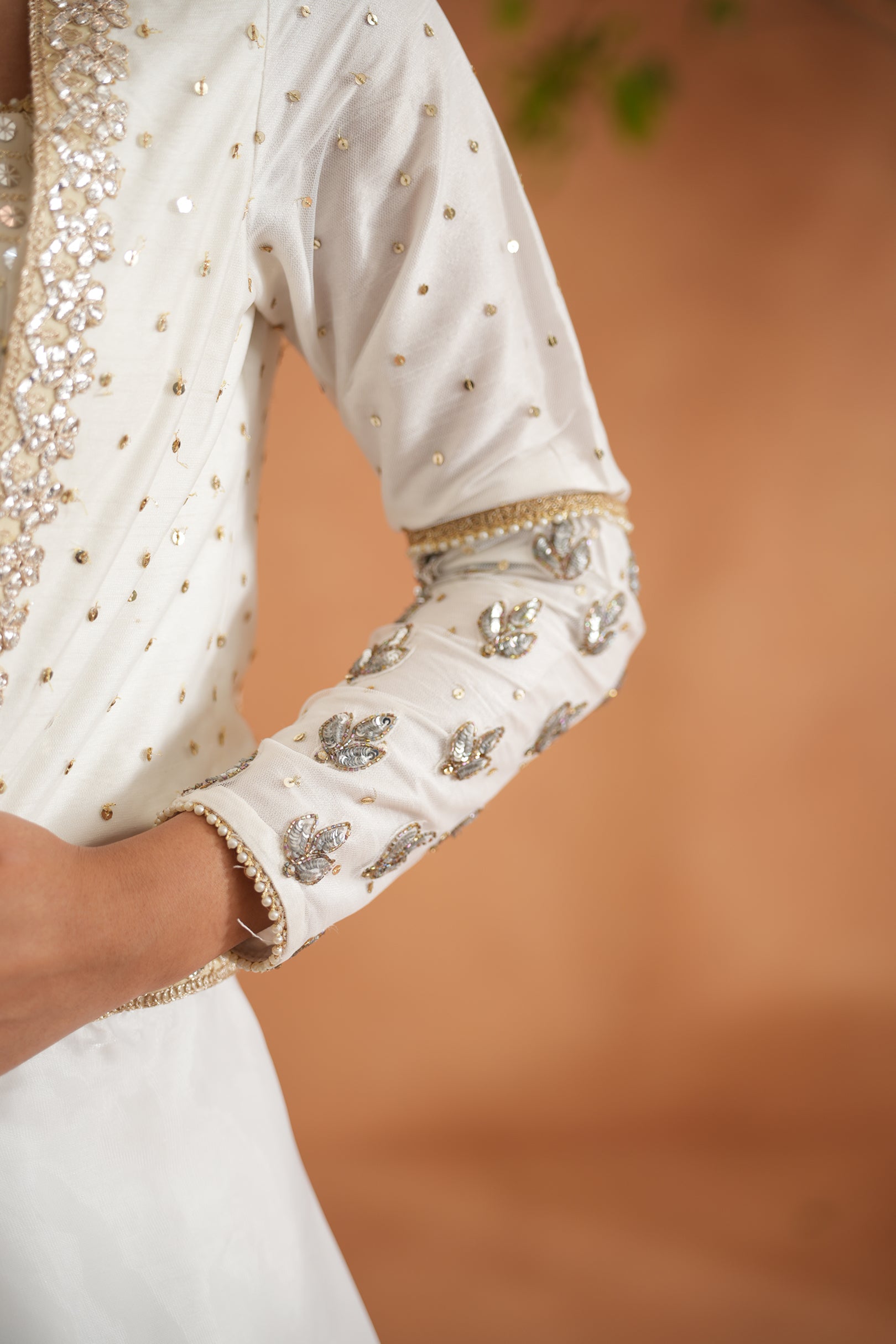 IVORY EMBROIDERED BUSTIER, LEHENGA AND SHORT JACKET