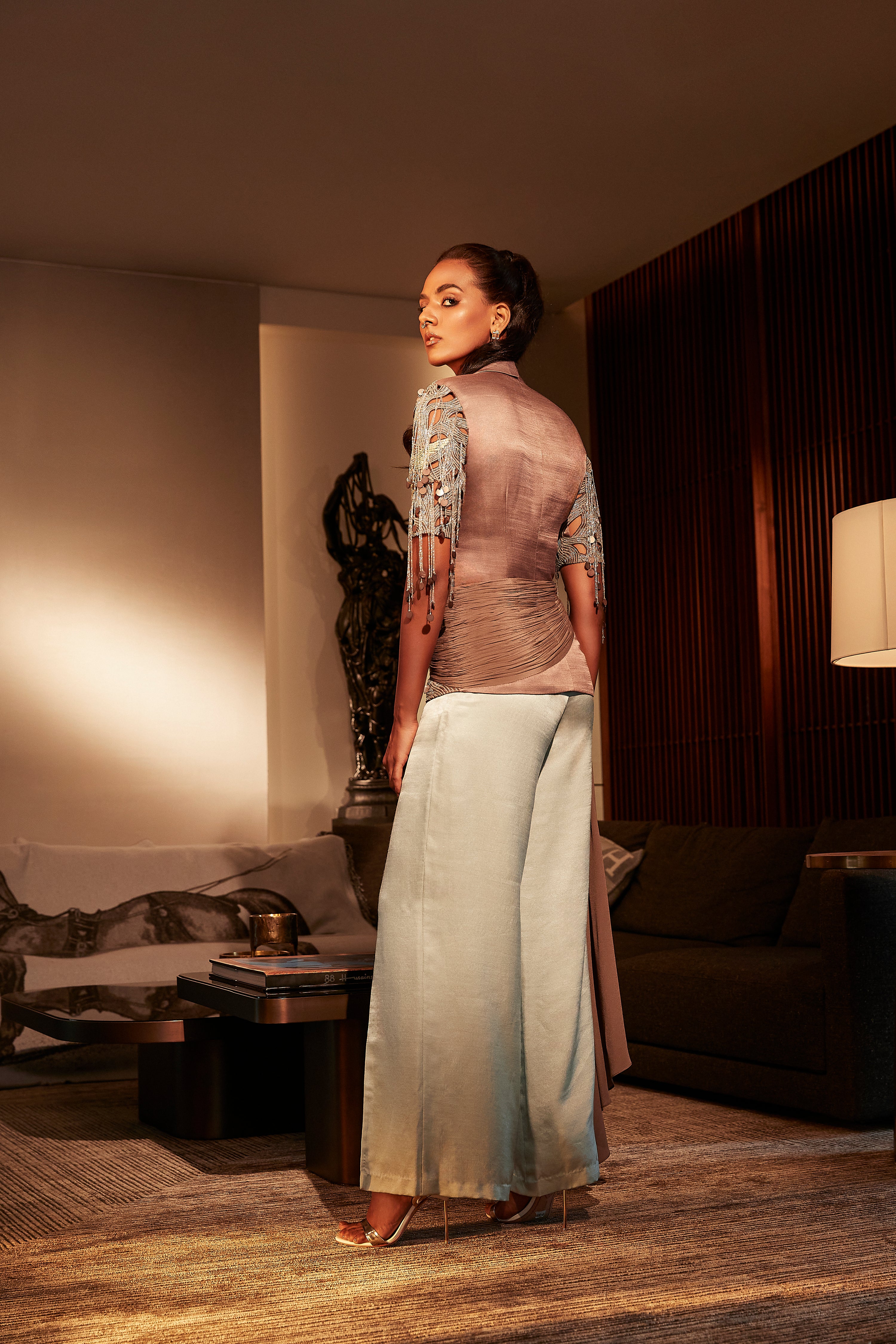 ESPRESSO STRUCTURED TOP WITH CUT-WORK EMBROIDERED SLEEVES TEAMED WITH FLARED PANTS