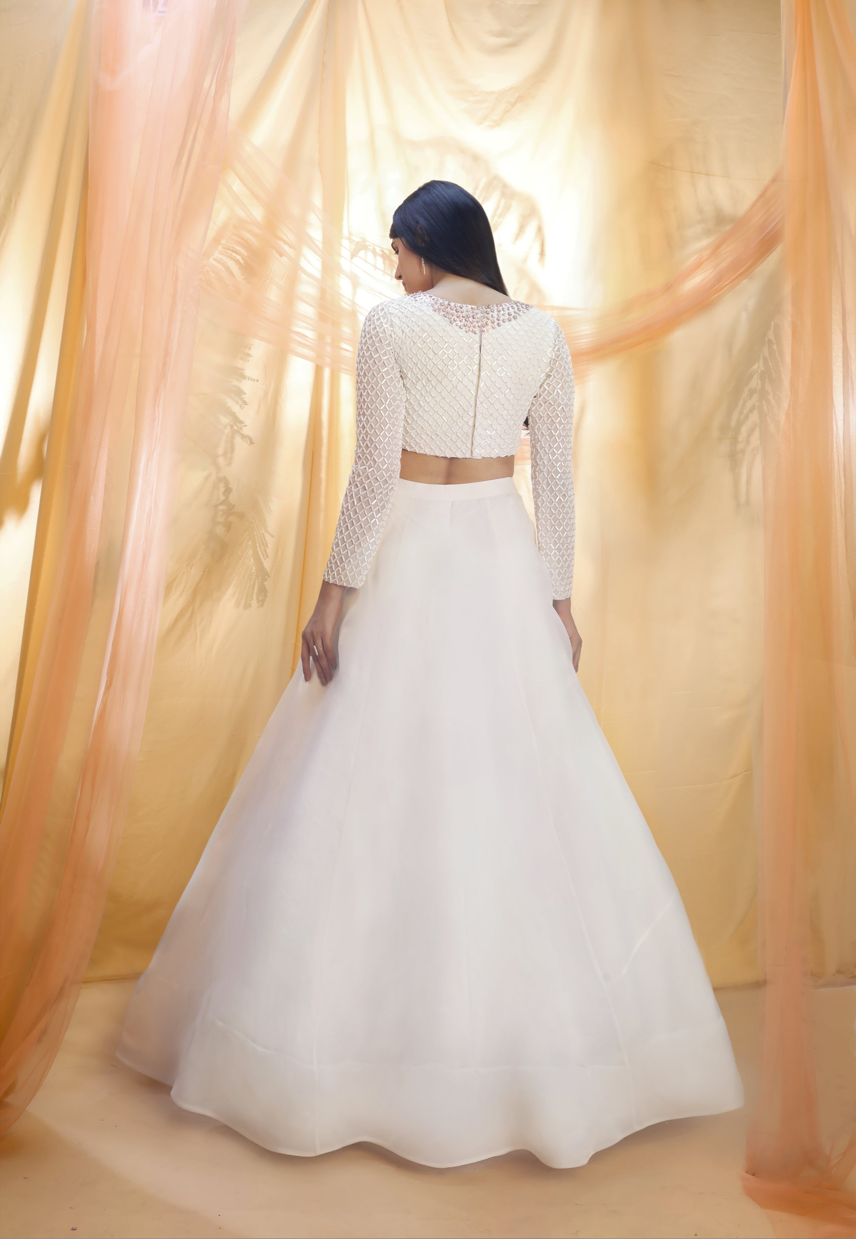 OFF WHITE LEHENGA WITH AN EMBROIDERED BLOUSE