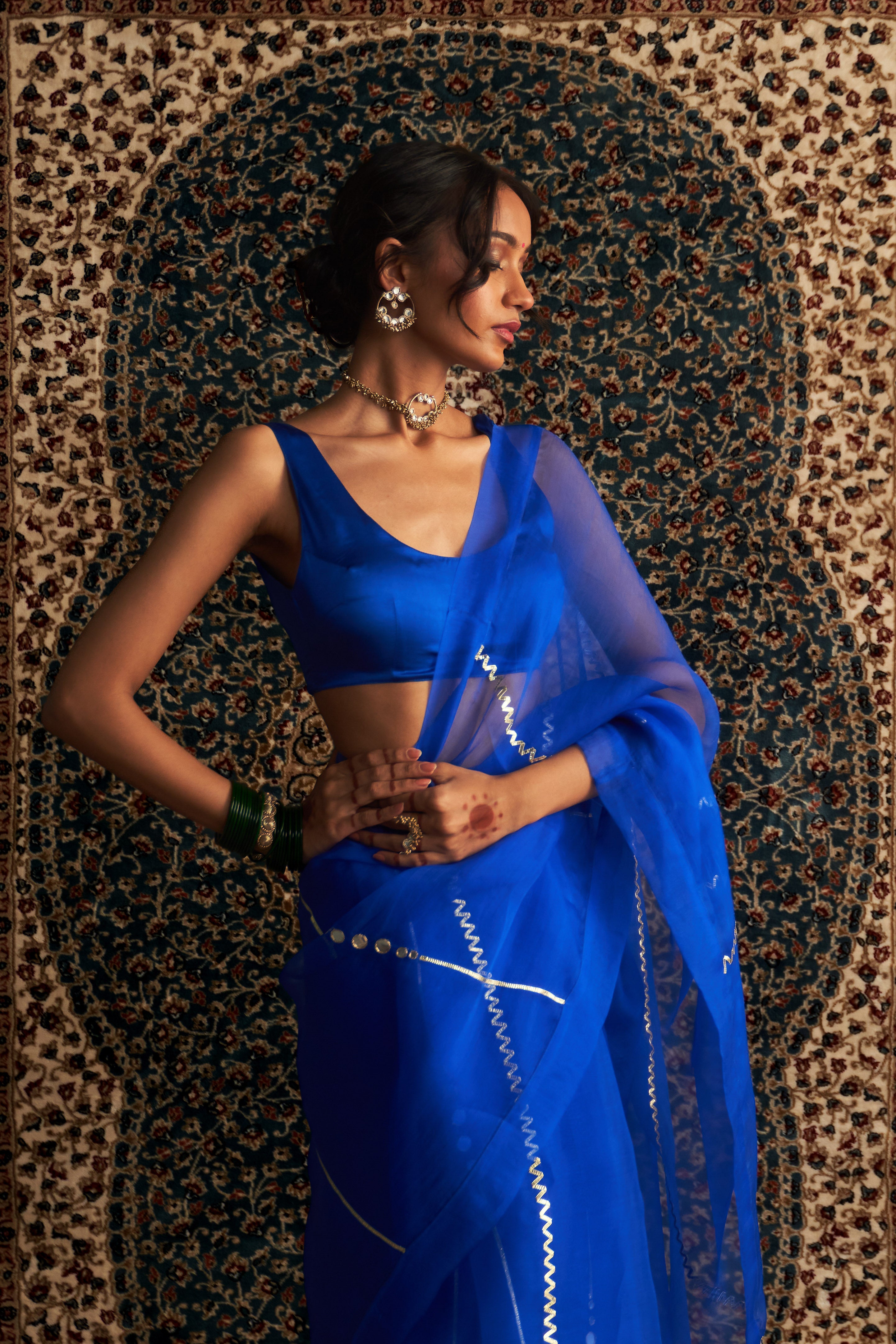 PRARAMBH EMBROIDERED ORGANZA SAREE WITH BLUE SLEEVELESS BLOUSE